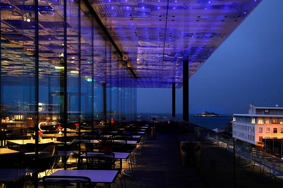 Rockheim - View night View of the sea in the evening taken from a resturant with blue and purple lights.